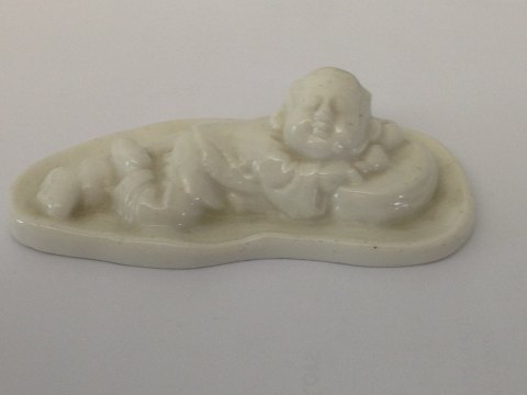 Royal Copenhagen Stentøjs Figur af Lille liggende Budda Dreng. Prøve Glasur