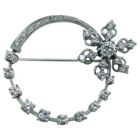A diamond brooch mounted in 18k white gold