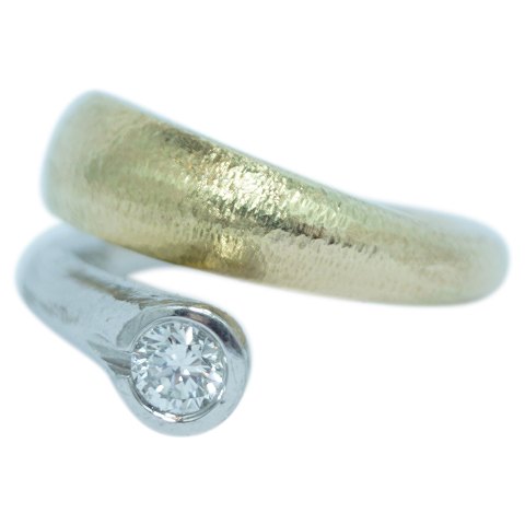 Ole Lynggaard; A diamond ring mounted in 14k gold and white gold