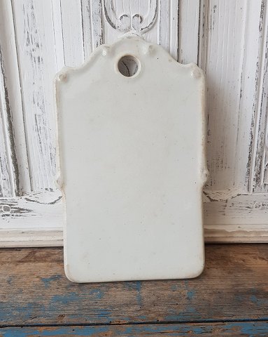 Beautiful onion board in cream colored faience