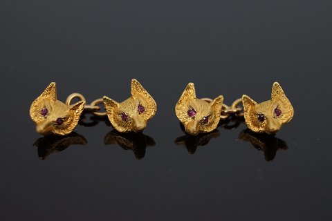 A pair of english cufflinks, 9k gold set with rubies, fox heads