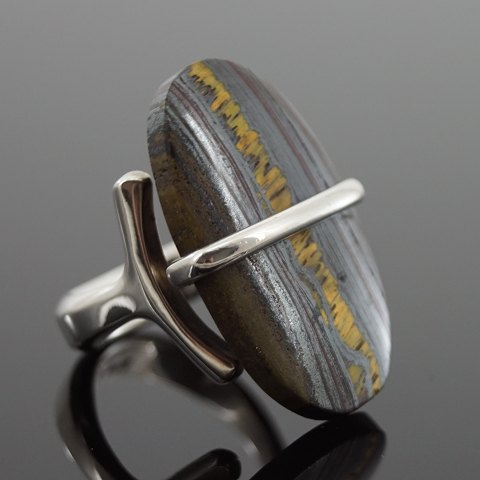 Georg Jensen, Vivianna Torun Bülow-Hübe; A ring of sterling silver with 
fossilised wood #190
