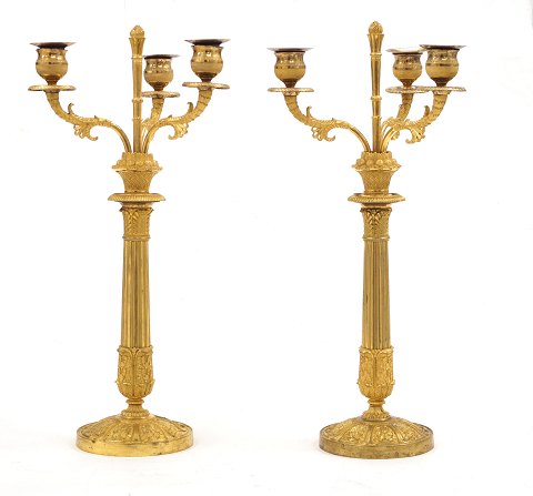 A pair of gilt early 19th century bronze 
candelabra. France circa 1820. H: 44cm