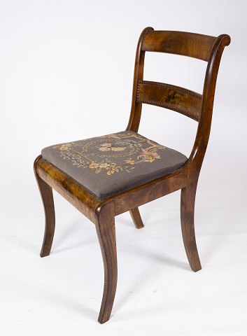 Chair of mahogany, upholstered with floral fabric from the 1840s. 
5000m2 showroom.