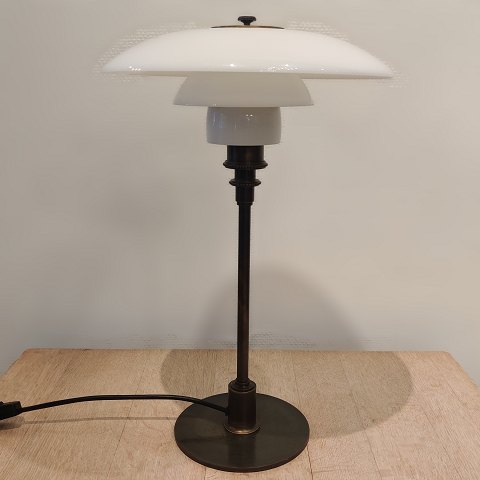Poul Henningsen; Jubilee PH-3/2 table lamp from 1994, of browned brass and 
shades of opalglass