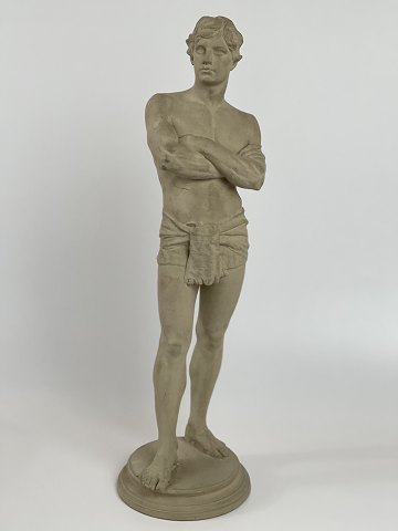 Antique terracotta figure of a standing man with loin cloth. The figure is 
stamped L. P. Jorgensen (Jørgensen), København (Copenhagen), Eneret (exclusive 
right). Circa 1890s.