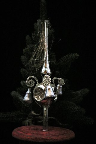 Old glass Christmas ornament in the form of a top spear...