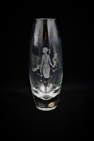 Fine Arne Bang Holmegaard glass vase with fine decoration of a woman in a field 
of flowers grinding into the vase...