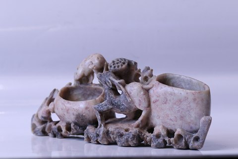 Table sculpture made of soapstone with a beautifully detailed animal motif and two compartments.