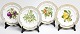 Royal Copenhagen Flora Danica open border dinner plates with fruit motifs.