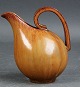 Arne Bang 1901-1983.
Jug with handle decorated with brown glaze.