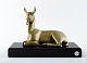 Irenee Rochard (1906-1984). A patinated bronze of a lying deer on base in black 
marble.