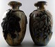 Roger GUERIN (1896-1954) A pair of large French Art Deco ceramic floor vases 
with blackberry stalks in relief.