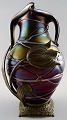 Art Nouveau art glass vase with bronze mounting.
Approximately 1900.
