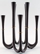 Rare Jens Quistgaard candlestick in cast iron for 8 lights.
