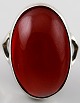 Silver ring with amber coloured stone.