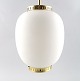 Bent Karlby: "The China light". Danish design.
Pendant in matte opal glass with brass fitting.
