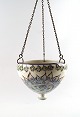 Aluminia hanging flower pot, decorated with flowers.
