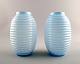 A pair of French Art Deco art glass vases in turquoise opaline glass.
