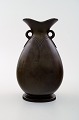 Vase, designed by Just Andersen.
The vase is made in "disko metal" and signed 