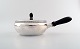 Georg Jensen. Covered Bowl in sterling silver, hammered bowl and lid, 
embellished with beading, fitted with handle and lid knob in ebony.