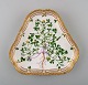 Royal Copenhagen Flora Danica" triangular porcelain dish decorated in colours 
and gold with flower. 
Royal Copenhagen 20/3508.