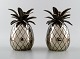 A pair of Art Deco candlesticks in the shape of pineapples in plated silver.