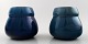 A pair of Rörstrand Art deco lidded vases in dark blue faience.
