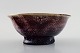 Scandinavian ceramist, art pottery bowl with purple glaze.

