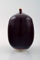 Scandinavian ceramist, art pottery vase with oxblood glaze.

