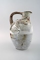 Jug of white glazed stoneware done by Gertrud Vasegaard (1913-2007), modeled 
with starfish on the side 1933-35.