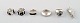 Samling smykker af sterlingsølv, de fleste med monteringer af ibenholt, 
bestående af 5 ringe og et vedhæng.
