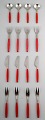 Complete service for 4 p., Henning Koppel. Strata cutlery from stainless steel 
and red plastic. Produced by Georg Jensen.