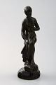 Figure of half-naked woman, designed by Just Andersen.
