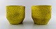 Ingrid Atterberg for Upsala-Ekeby a pair of flower pots in strong yellow glaze.