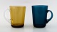 Kaj Franck (Finsk, 1911–1989) Nuutajärvi Glass Works, Finland, kunstglas. 2 krus 
med hank i forskellige farver.
Finland 1960/70´erne.