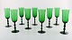 SIMON GATE ORREFORS, A set of nine green champagne art glasses. 
Designer: Simon Gate.