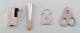 Four pieces Danish silver, including Hugo Grün.
Lighter, cigarette holder and two cigar clippers.