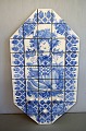 Bjørn Wiinblad (1918-2006). Huge octagonal unique wall light / relief with three 
light arms made of blue glazed ceramic tiles.