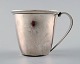 Baby cup with handle by Evald Nielsen hammered sterling silver.
