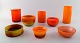 Collection of Scandinavian orange art glass vases and bowls, Holmegaard and 
more.