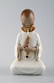 Arno Malinowski for Royal Copenhagen, number 2342 Opium Smoking girl. Porcelain 
figurine in overglaze.