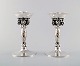 Georg Jensen, pair of candlesticks hammered sterling silver, adorned with 
twisted vines and grape bunches.