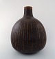 Saxbo: Very large and rare teardrop shaped vase with vertical fluted pattern, 
decorated with dark brown glaze.