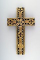 Aluminia / Royal Copenhagen cross of faience designed by Kari Christensen, 
decorated with colored glazes and gold.
