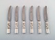 Georg Jensen. Cutlery, Scroll No. 22, Hammered Sterling silver consisting of: 6 
fruit knives.