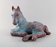 Michael Andersen: lying foal / horse in green and violet glaze.