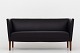 Roxy Klassik presents: Grete Jalk / Snedkermester Johannes Hansen2-seater sofa in black leather and legs in ...