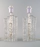 A pair of modernistic Pukeberg table lamps in art glass.
