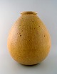 Saxbo: Rare and colossal drop-shaped floor vase with vertical grooves, decorated 
with beautiful glaze in yellow shades.